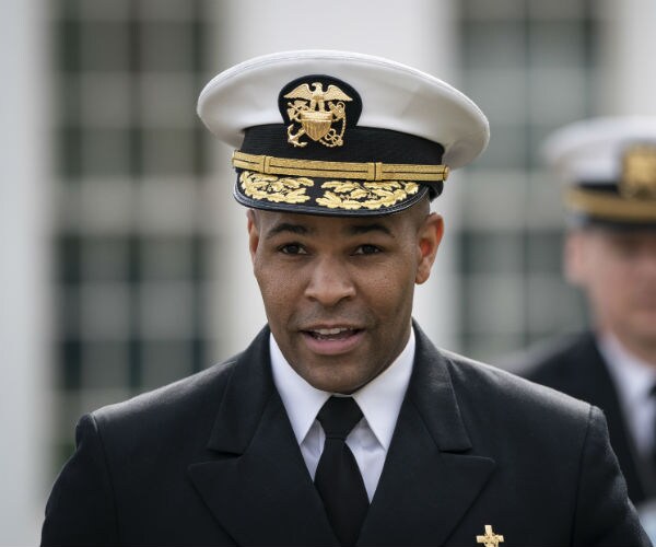 surgeon general jerome adams is shown outside the white house