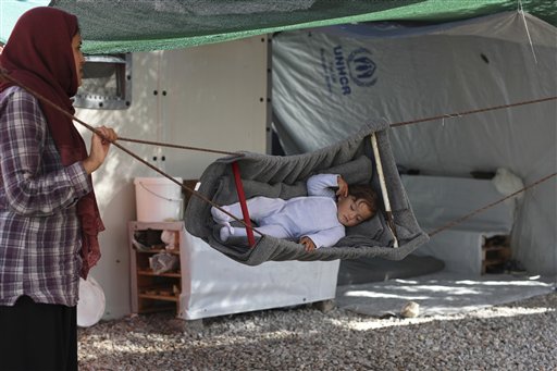 The Latest: Greek Coast Guard Rescues Boat with 131 Migrants