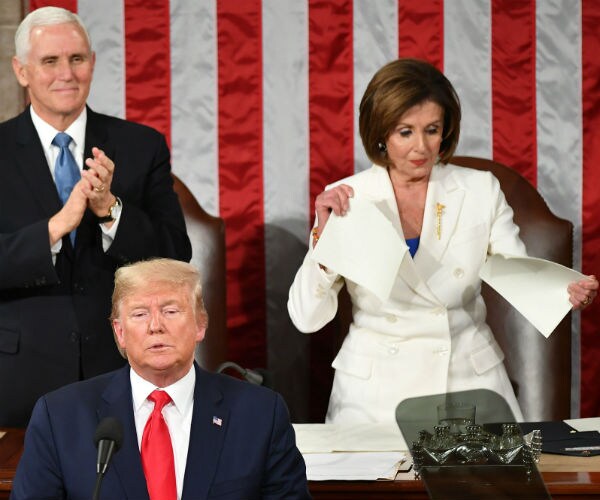 nancy pelosi  on right in white suite with mike pence tears her copy of the SOTU speech by president donald trump