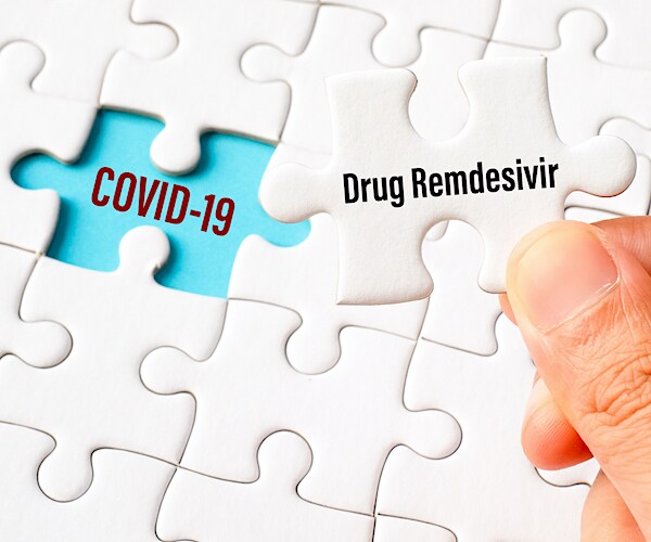 a white puzzle with a missing piece marked covid-19 and the final piece marked remdesivir