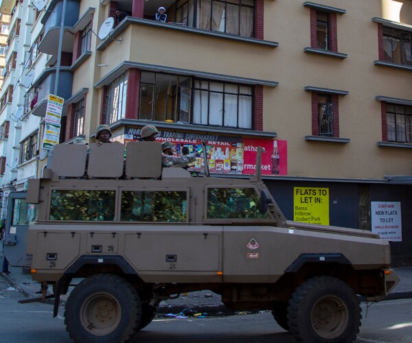 a south african national defence forces vehicle drives in johannesburg, south africa