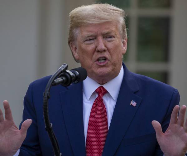 president donald trump speaking at an outdoor press conference