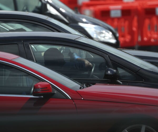 cars are shown, some with drivers, some without