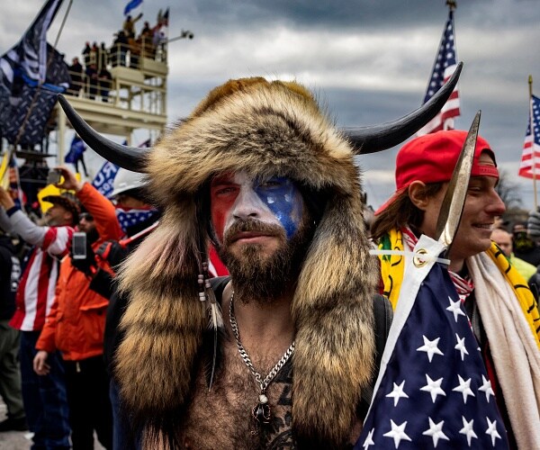 jacob chansley stands outside