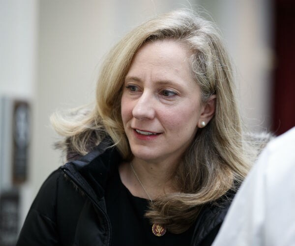 Rep. Abigail Spanberger is shown in a black dress