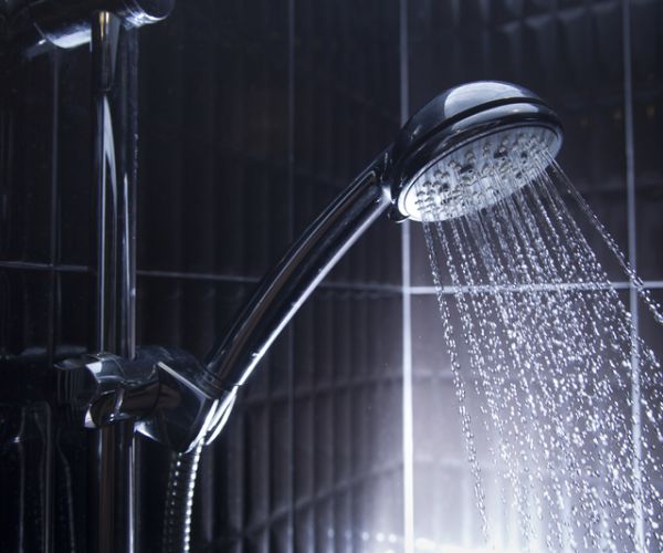 showerhead spraying water in shower