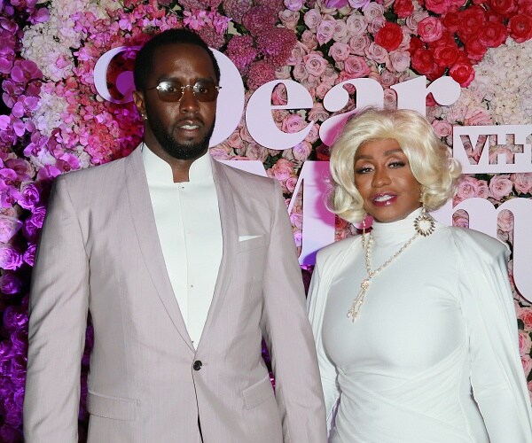 sean diddy combs stands with mom janice combs on red carpet