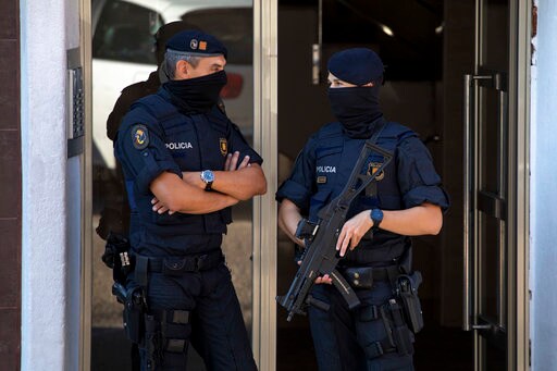 The Latest: Security Increased at Police Stations in Spain