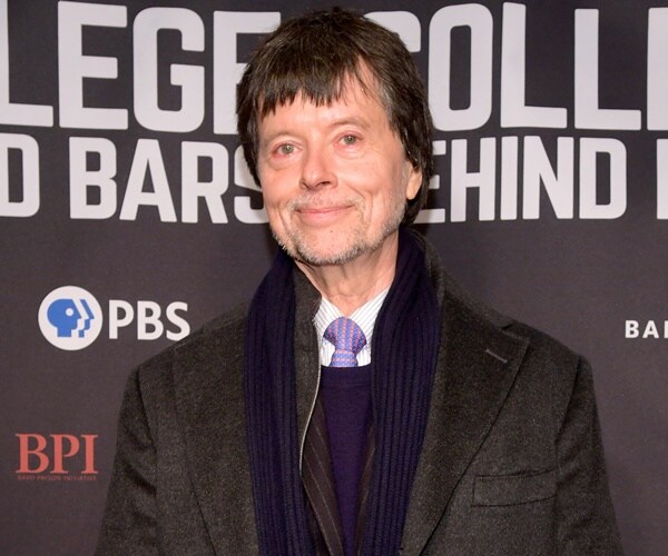 ken burns poses at a screening for a documentary film