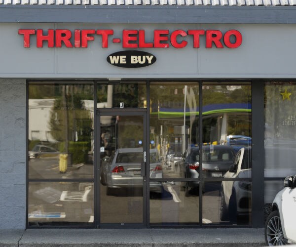  a pawn shop alleged to have been a front for a theft ring involving Amazon drives stands closed in Renton, Wash.