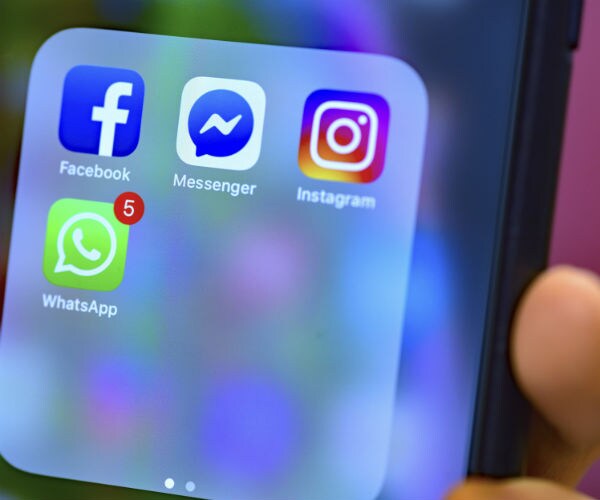 facebook, messenger and instagram apps are seen on a cell phone screen