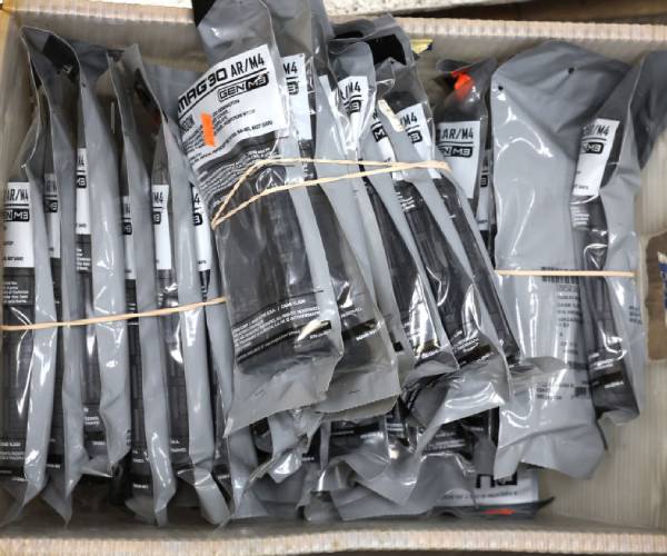 High-capacity gun magazines in wrapping in a box