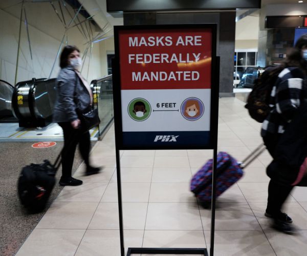People walk through Sky Harbor International Airport 