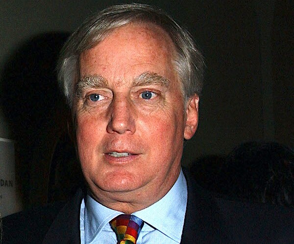 robert trump stands for a posed photo in 2004