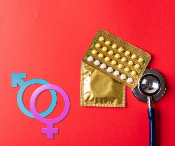 condoms in package, birth control pills, male and female symbols