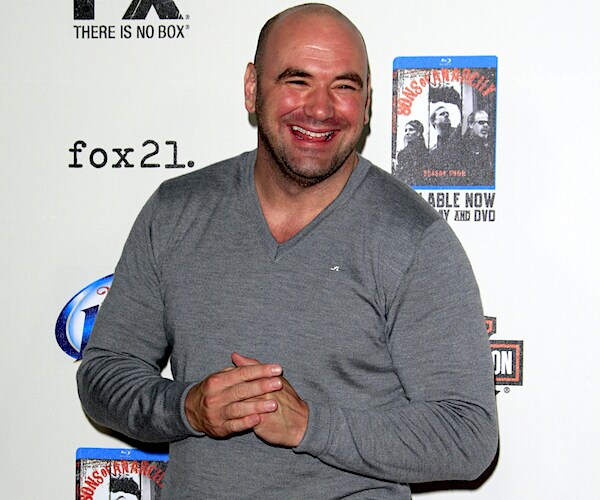 Dana White smiles on the red carpet for a television premiere