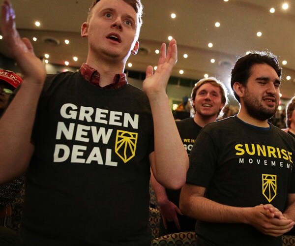 climate activists of the green new deal and the sunrise movement in a rally