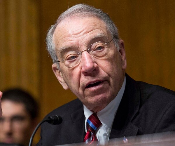 sen. chuck grassley sits in a hearing speaking