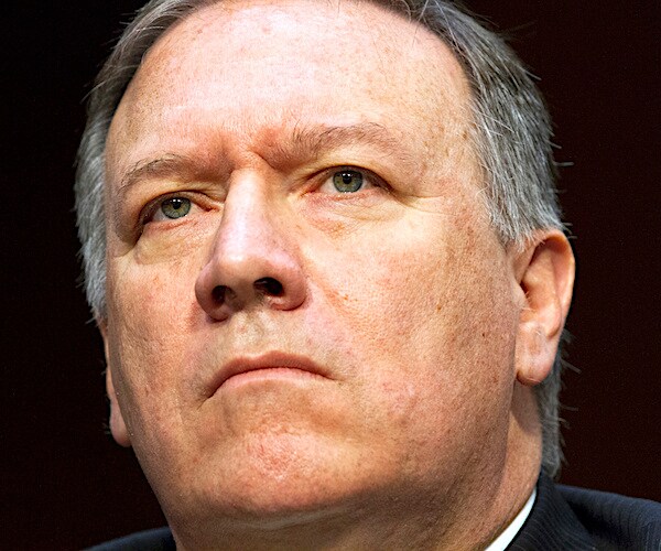 mike pompeo looks up during congressional testimony
