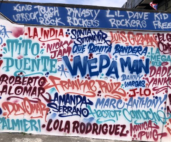 wall with names of puerto rican celebrities spray painted on it