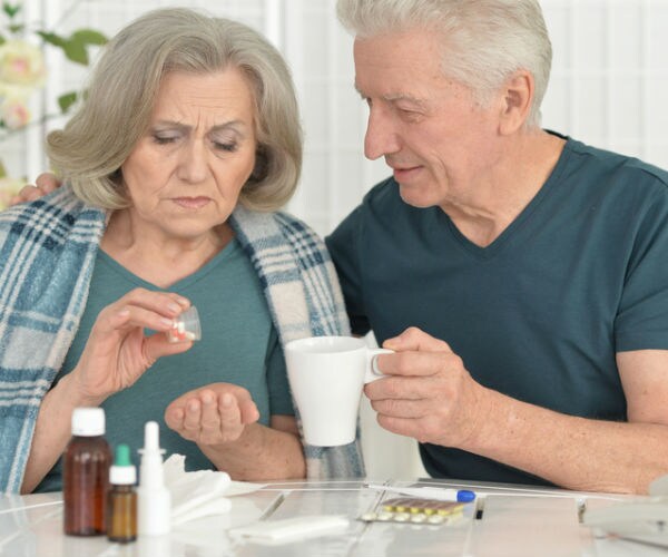 picture of a man and woman with cold medications