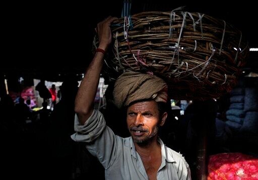 Hit by Pandemic Curbs, India's Quarterly Growth Slows to 4%