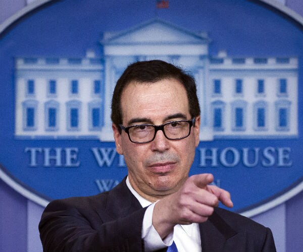 steve mnunchin is shown at the white house doing a press briefing