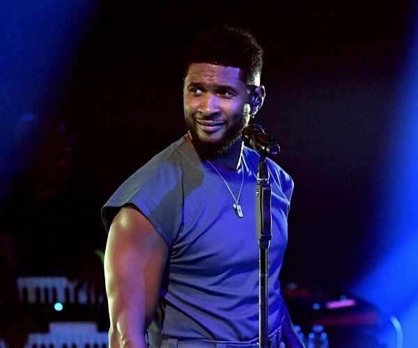 usher performs onstage