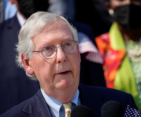mitch mcconnell stands on capitol steps