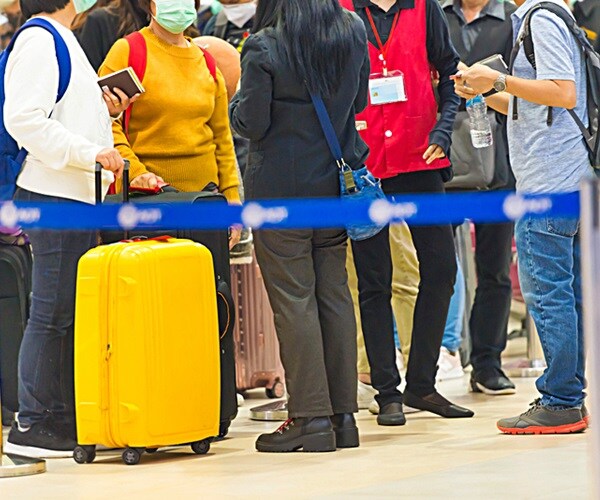 Expect Plexiglass, Face Masks, Miles of Lines When Airports Reopen