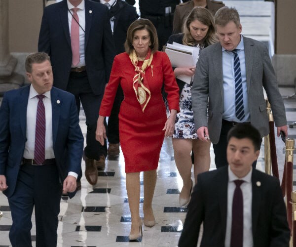 House Speaker Nancy Pelosi, D-Calif., walks from the chamber through Statuary Hall.