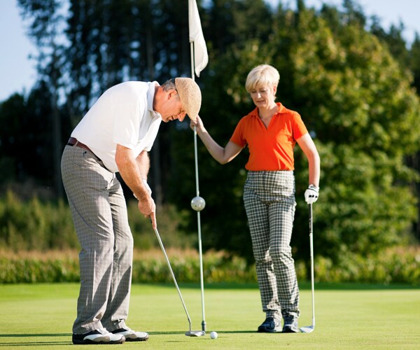 senior citizens playing golf