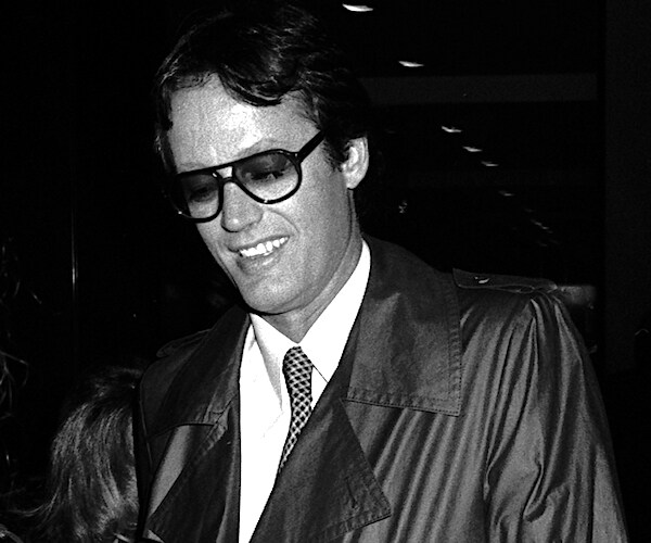 The late Peter Fonda dons sunglasses and smiles in an old black and white photo