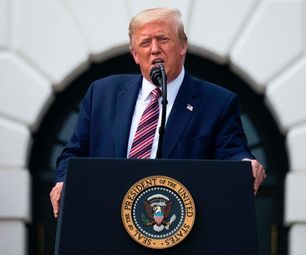 president donald trump at a podium