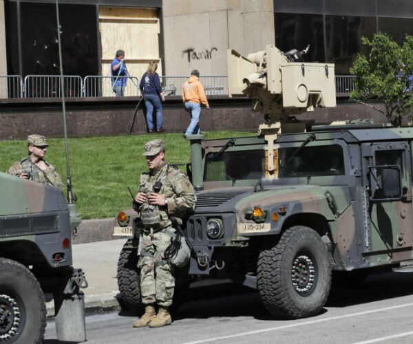 the national guard stands outside the justice center in cleveland, ohio