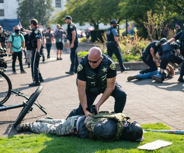 police arrest a right wing protester