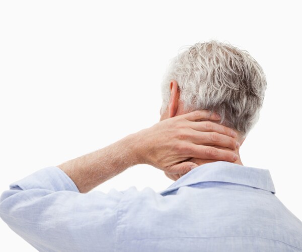 a man suffering from neck pain