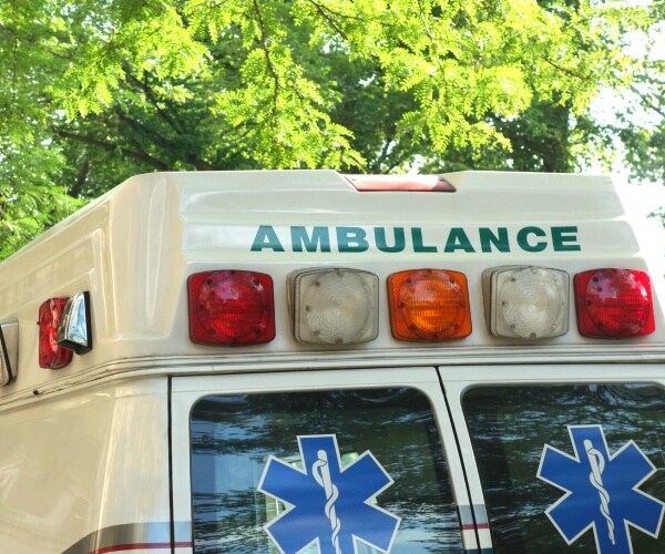 ambulance is shown with a tree in the background
