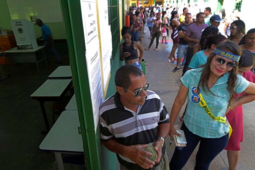 The Latest: Brazilians Begin Voting for Next President