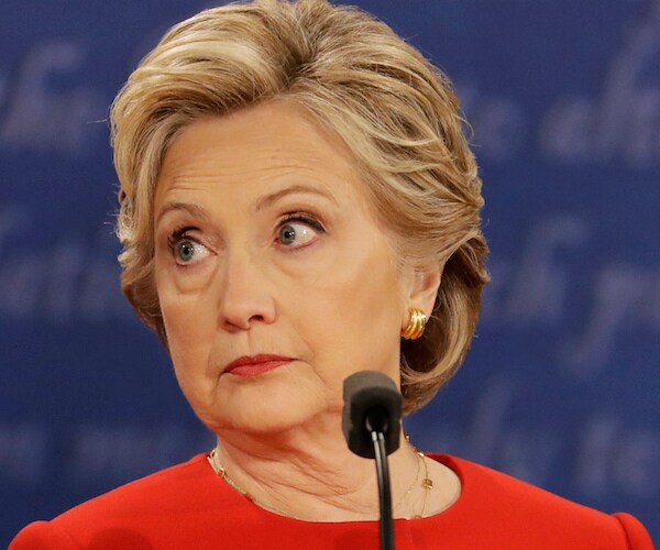 hillary clinton looks to her right during a presidential debate in 2016
