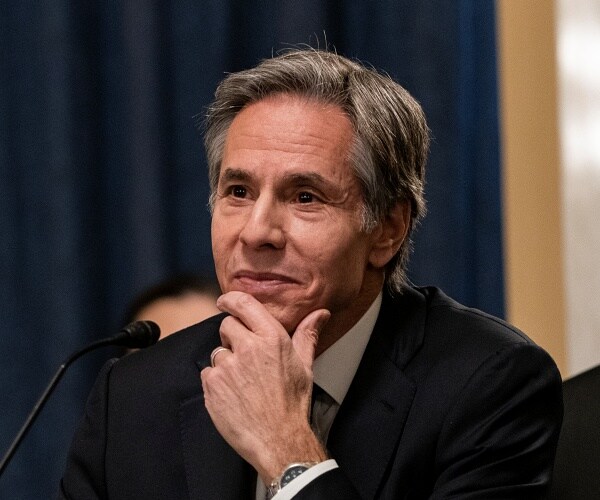 antony blinken rests chin on hand