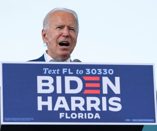 joe biden on a podium in florida