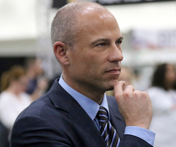 michael avenatti holds his chin on the back of the thumb of his right hand