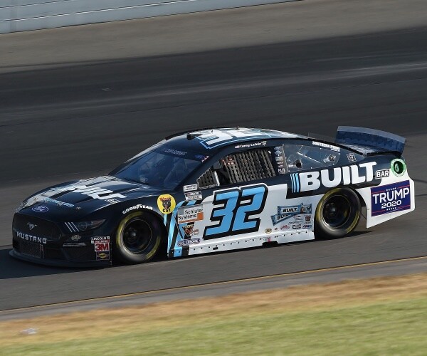 nascar race with a car displaying trump 2020 on it