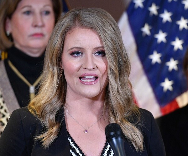 jenna ellis speaks into mic