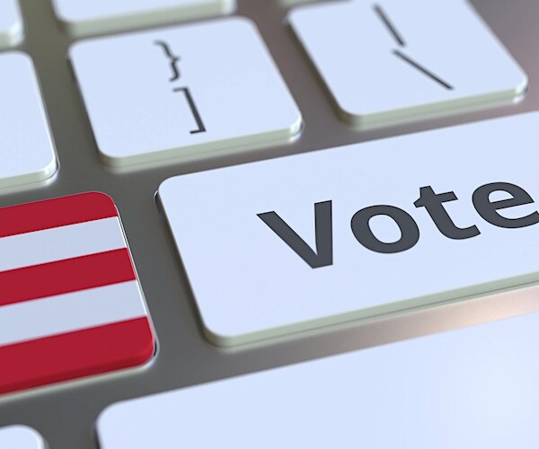 a computer keyboard shows the puerto rico flag and a vote button