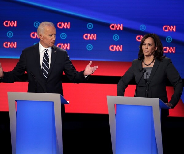 kamala harris listens to joe biden speak