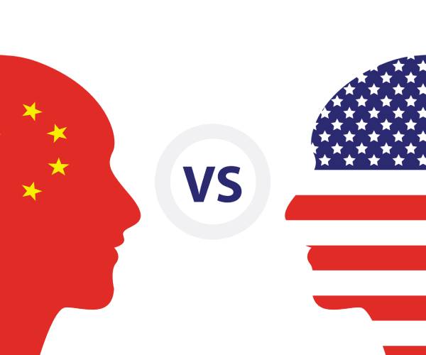 two heads with chinese and american flags on them