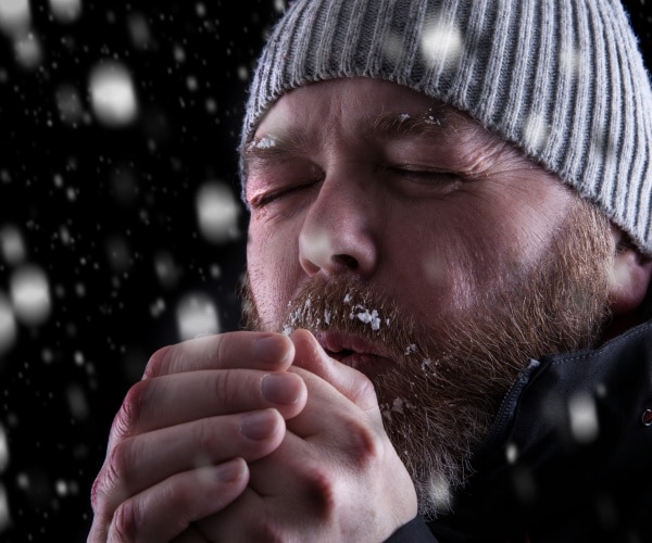 man in hat outside in cold
