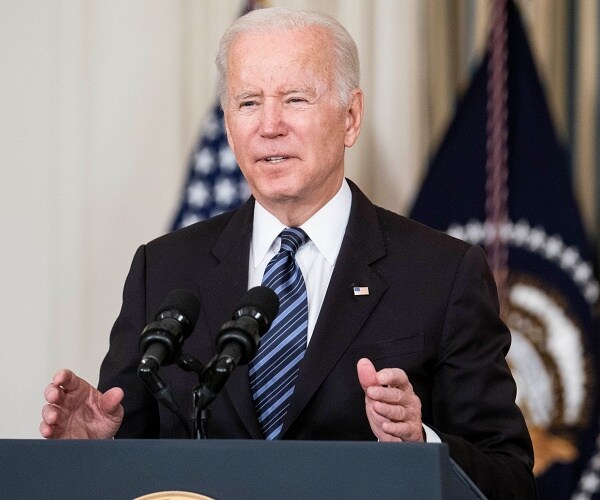 biden speaks into mic in state dining room